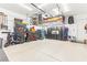 Spacious three-car garage featuring ample storage and epoxy flooring at 163 Caraset Ln, Henderson, NV 89011