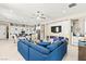 Spacious kitchen and living room combo with modern fireplace, seating, and blue accents at 163 Caraset Ln, Henderson, NV 89011