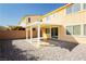Backyard patio area with a stone landscape at 1633 Dornie Ave, North Las Vegas, NV 89084