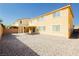 A spacious backyard showcasing an expansive rock landscape and rear exterior view at 1633 Dornie Ave, North Las Vegas, NV 89084