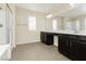 Beautiful bathroom featuring dual sinks, granite countertop, shower and bath at 1633 Dornie Ave, North Las Vegas, NV 89084