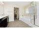 Bright bathroom featuring shower, tub, granite countertop and tiled floor at 1633 Dornie Ave, North Las Vegas, NV 89084