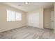 Cozy bedroom with plush carpet, closet, and ample natural light streaming through the window at 1633 Dornie Ave, North Las Vegas, NV 89084