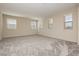Spacious bedroom featuring neutral carpet, multiple windows, and a bright, airy atmosphere at 1633 Dornie Ave, North Las Vegas, NV 89084
