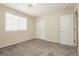 Inviting bedroom features plush carpet, neutral walls, and a large closet for storage at 1633 Dornie Ave, North Las Vegas, NV 89084