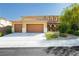 Inviting home with a two car garage, meticulous landscaping, and neutral colors at 1633 Dornie Ave, North Las Vegas, NV 89084