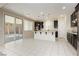 Eat-in kitchen featuring stainless appliances, white countertops and tile flooring at 1633 Dornie Ave, North Las Vegas, NV 89084