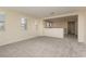 Expansive living room offering ample light, neutral paint, and carpeted floors at 1633 Dornie Ave, North Las Vegas, NV 89084