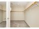 Empty walk-in closet featuring carpeted floor, and shelving for storage at 1633 Dornie Ave, North Las Vegas, NV 89084