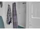 Bathroom with shower-tub combo with a shower curtain and tiled walls at 1800 Red Rock Dr, Pahrump, NV 89048