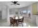Bright eat-in kitchen features tiled floor, a breakfast nook and a white color scheme at 1800 Red Rock Dr, Pahrump, NV 89048