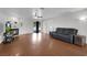 Spacious living room boasts hardwood floors, a cozy fireplace, and sliding glass doors to the backyard at 1800 Red Rock Dr, Pahrump, NV 89048