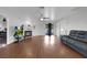 Comfortable living room features hardwood floors, a fireplace, and access to the backyard at 1800 Red Rock Dr, Pahrump, NV 89048
