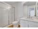 A modern bathroom with tiled shower, marble countertop, and contemporary fixtures at 2050 N Los Feliz St # 171, Las Vegas, NV 89156