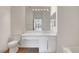 Bright bathroom featuring a modern vanity, large mirror, and tub with tiled walls at 2050 N Los Feliz St # 171, Las Vegas, NV 89156