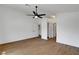 Bright bedroom features wood-look flooring, white walls, ceiling fan, and closet space at 2050 N Los Feliz St # 171, Las Vegas, NV 89156