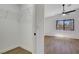 The bedroom boasts wood-look floors, a ceiling fan, and a window to the outside at 2050 N Los Feliz St # 171, Las Vegas, NV 89156