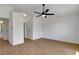 This bedroom features wood-look flooring, ceiling fan, and white walls at 2050 N Los Feliz St # 171, Las Vegas, NV 89156