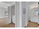 Hallway featuring closet with laundry and a bathroom with modern fixtures at 2050 N Los Feliz St # 171, Las Vegas, NV 89156