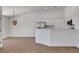 Bright open kitchen with stainless steel appliances, white cabinets, and a large breakfast bar for casual dining at 2050 N Los Feliz St # 171, Las Vegas, NV 89156
