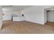 Open-concept living space with modern flooring, bright lighting, and seamless flow to kitchen at 2050 N Los Feliz St # 171, Las Vegas, NV 89156