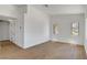 Bright living room showcasing modern flooring, dual windows, and a versatile, open layout at 2050 N Los Feliz St # 171, Las Vegas, NV 89156