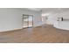 Bright living room with modern flooring, sliding door access, and seamless flow to kitchen at 2050 N Los Feliz St # 171, Las Vegas, NV 89156