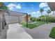 Backyard with synthetic grass, desert landscaping, concrete patio, pergola, and lounge chairs with heater at 21 Rue De Degas, Henderson, NV 89074