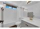 Well-lit bathroom with tub, shower, toilet, and vanity with modern fixtures at 21 Rue De Degas, Henderson, NV 89074