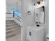 Modern bathroom with vanity, mirror, and stairway access, bathed in natural light at 21 Rue De Degas, Henderson, NV 89074