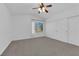 Bright bedroom with ceiling fan, closet and a window overlooking the neighborhood at 21 Rue De Degas, Henderson, NV 89074