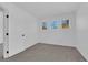 Bedroom featuring neutral carpet and three windows offering ample natural light at 21 Rue De Degas, Henderson, NV 89074
