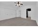 Spacious bedroom with double closets, fan, and an ensuite bathroom with modern features at 21 Rue De Degas, Henderson, NV 89074