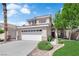 Charming two-story home with a well-manicured lawn and a two-car garage at 21 Rue De Degas, Henderson, NV 89074