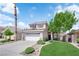 Charming two-story home with a well-manicured lawn and a two-car garage at 21 Rue De Degas, Henderson, NV 89074