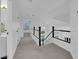 Upstairs hallway with stairs, neutral carpet, and a view into the bedroom at 21 Rue De Degas, Henderson, NV 89074