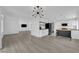 Open kitchen area features an island, tile backsplash and black appliances at 21 Rue De Degas, Henderson, NV 89074