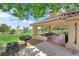 Community picnic area with BBQ grills, seating, and a tile roof structure for enjoying outdoor gatherings and meals at 21 Rue De Degas, Henderson, NV 89074