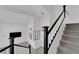Carpeted staircase with white railings and black accents, leading to a spacious living area at 21 Rue De Degas, Henderson, NV 89074