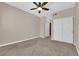 Bedroom with neutral walls, carpeted floors, a ceiling fan, and closet at 2291 W Horizon Ridge Pkwy # 6131, Henderson, NV 89052