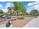 Community featuring gravel, a grassy area, and a grilling area on a sunny day at 2291 W Horizon Ridge Pkwy # 6131, Henderson, NV 89052