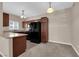 Kitchen featuring dark wood cabinets, modern appliances, and a bar-style counter at 2291 W Horizon Ridge Pkwy # 6131, Henderson, NV 89052