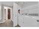 Laundry room featuring a washer and dryer and shelving for storage, next to a hallway at 2291 W Horizon Ridge Pkwy # 6131, Henderson, NV 89052