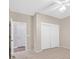 Bedroom featuring neutral carpet, a closet, and two doors at 2428 Hamonah Dr, Henderson, NV 89044