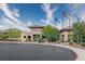 Exterior of community clubhouse with desert landscaping, seating area and American flags at 2428 Hamonah Dr, Henderson, NV 89044
