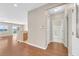 Spacious hallway with hardwood floors connects to a kitchen and bathroom at 2428 Hamonah Dr, Henderson, NV 89044