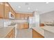 Bright kitchen featuring tile floors, wooden cabinets, and modern appliances, great for cooking at 2428 Hamonah Dr, Henderson, NV 89044