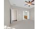 Spacious primary bedroom with carpet flooring and access to an ensuite bathroom at 2428 Hamonah Dr, Henderson, NV 89044
