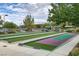 Community shuffleboard courts with covered seating and lush landscaping provide outdoor recreation at 2428 Hamonah Dr, Henderson, NV 89044