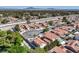 An aerial view of a neighborhood featuring a home with a terracotta roof and desert landscaping at 2501 Muirfield Ave, Henderson, NV 89074